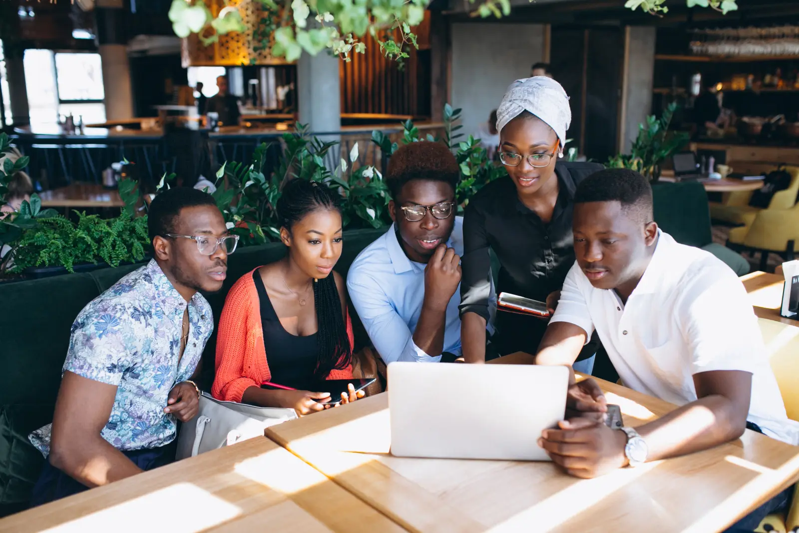 A team reviewing nutrition plans together on a laptop